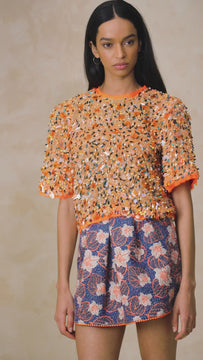 The Shelby top has short sleeves with padded shoulders, a crew neckline, and full interior lining.