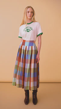 The Stratton Skirt in yarn dyed Tetbury Plaid has a wide waist yoke and a shirred, pleated skirt.