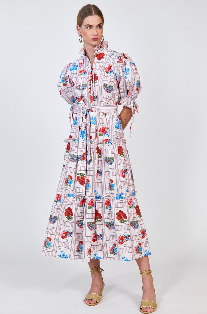 The Holloway dress has a ruffled split neck with tie detail, short puff sleeves and a self-tie belt.