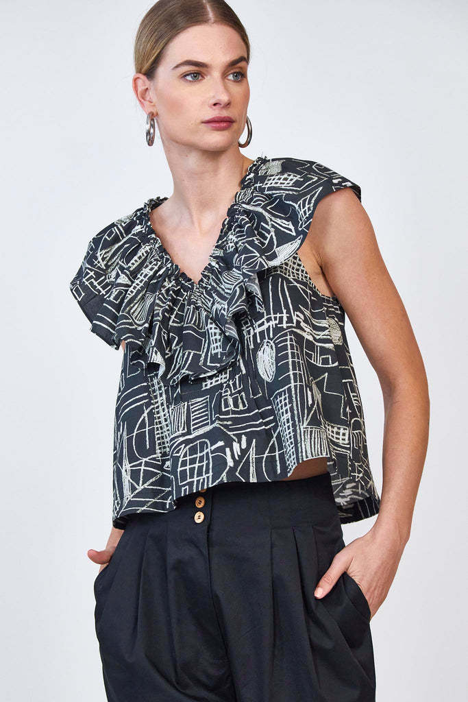 The Keller sleeveless top has a flutter design at the v neckline and a boxy, relaxed fit.